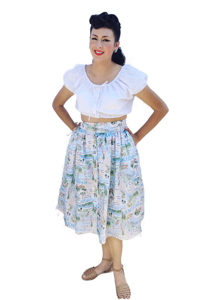 Lily Gómez wearing the Aurora Skirt in the Californio print paired with the Mary Cropped Top, showcasing a vintage-inspired gathered cotton skirt.