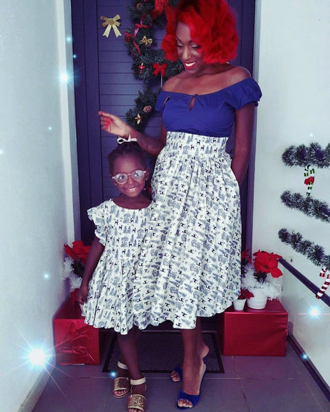 Adult wearing the Ella Mae Skirt and child wearing the matching Gianna Dress in the Queen of the Forest woodland print.