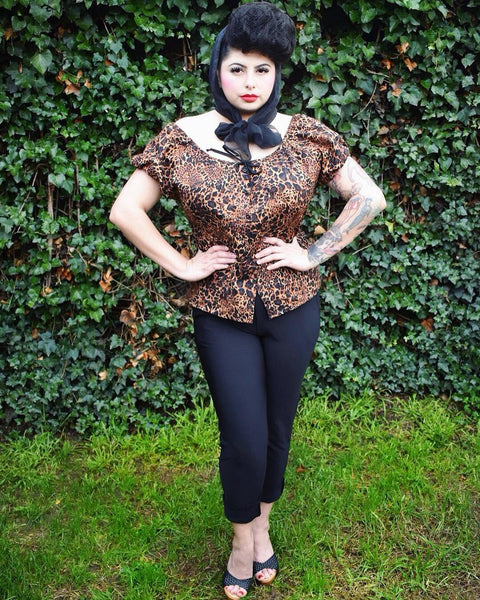Front view of a model wearing the Leopard Mary Blouse by Lil' Lou Lou, showcasing the button-front detail and vintage-inspired silhouette.