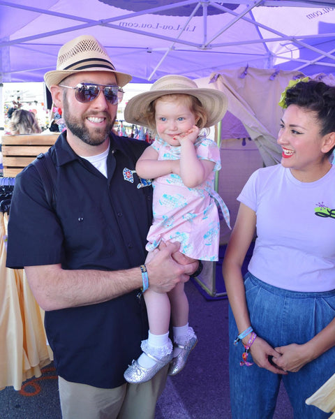 Young customer wearing Lil' Lou Lou Melly Dress in pink Classic Truck print at the Viva Las Vegas rockabilly event