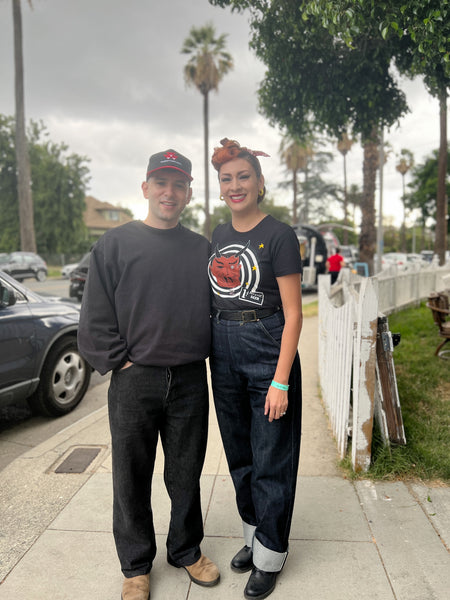 Mystic Steer graphic tee styled with vintage-inspired denim at a community event
