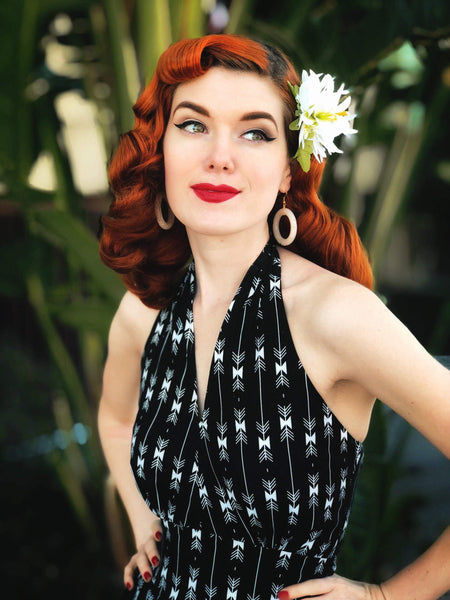 Close-up of the Wanda Dress in black arrow print featuring the halter neckline and shaped waist detail.