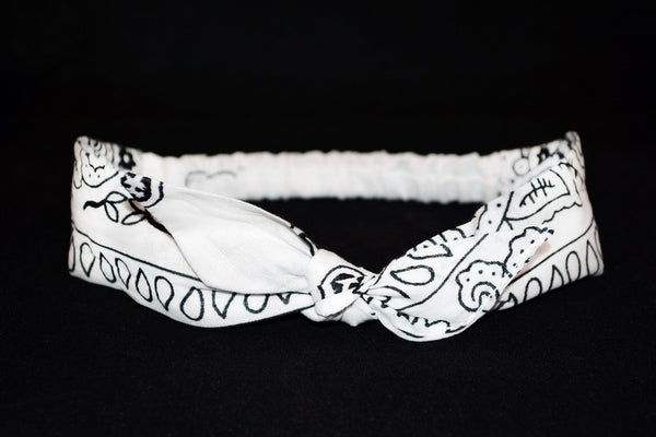 White bandana print 4 in 1 headband featuring a removable bow and elastic back.
