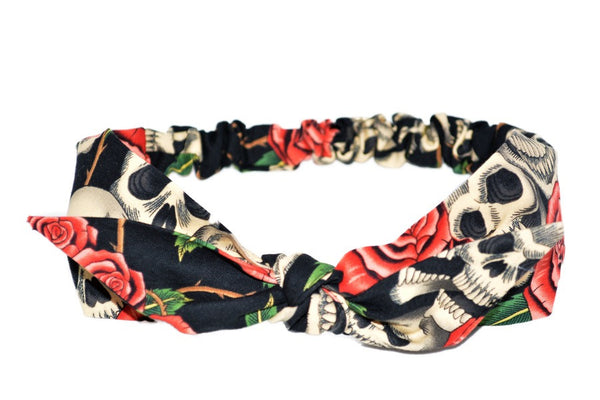 Lil' Lou Lou's Peach Skull Roses 4 in 1 Headband featuring a skull and rose print with a removable bow.