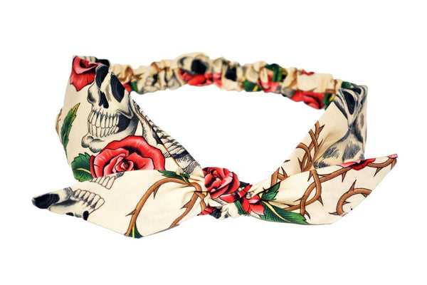 Lil' Lou Lou 4 in 1 Beige Skull Roses Headband featuring a beige skull and rose print with a removable bow and elastic back.