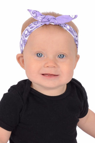 Baby wearing Classic Lilac 3 in 1 headband with removable bow