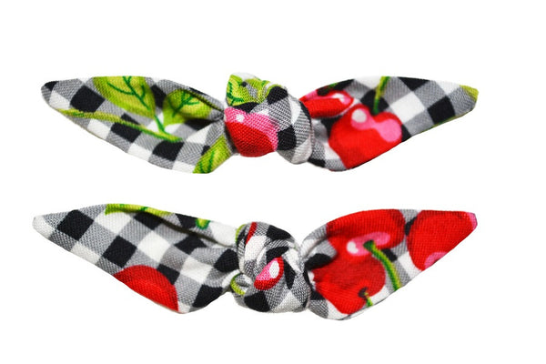Set of two Cherry Picnic Cute Knotted Bow hair clips featuring a black and white picnic check print with red cherries.