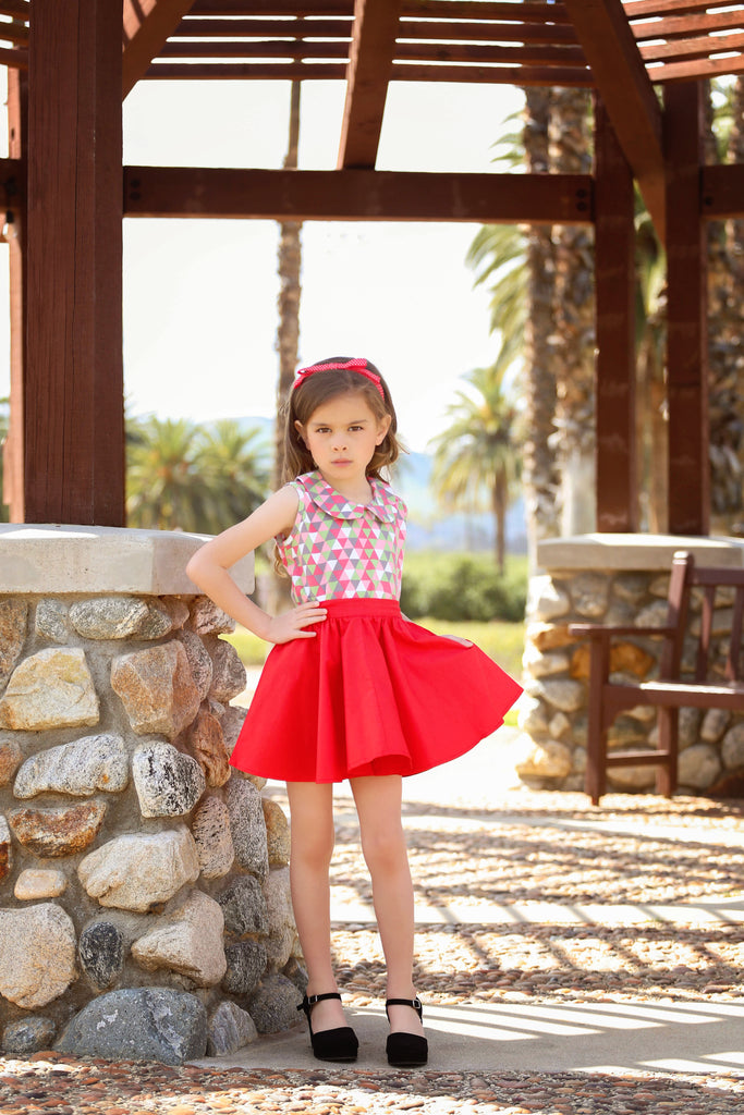 Girl wearing vintage inspired red Kids Jivin' Skirt by Lil' Lou Lou with Harlequin Wendy Blouse and red Jackie Headband.