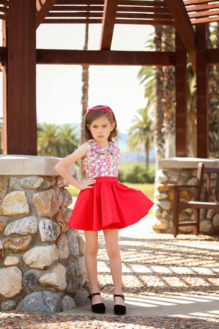 Girl wearing vintage inspired red Kids Jivin' Skirt by Lil' Lou Lou with Harlequin Wendy Blouse and red Jackie Headband.