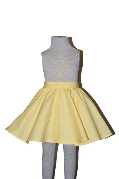 Yellow cotton Kids Jivin' Skirt by Lil' Lou Lou displayed on mannequin with full circle skirt silhouette and elasticized back waistband.