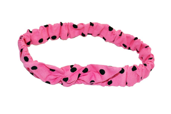 Pink and black polka dot Mommy & Me Headband with elasticized band and knotted bow detail for babies and toddlers.