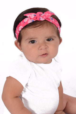 Baby wearing Lil' Lou Lou Pink Flamingos Mommy & Me Headband with soft elastic band and knotted bow detail.