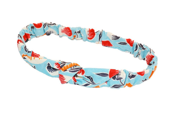 Lil' Lou Lou Sherry Mommy & Me Headband featuring an aqua novelty print, elasticized back, and knotted bow detail.