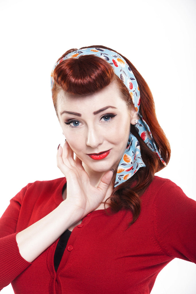 Red-haired model wearing Lil' Lou Lou's Sherry print Bombshell Hair Wrap in a vintage hairstyle.