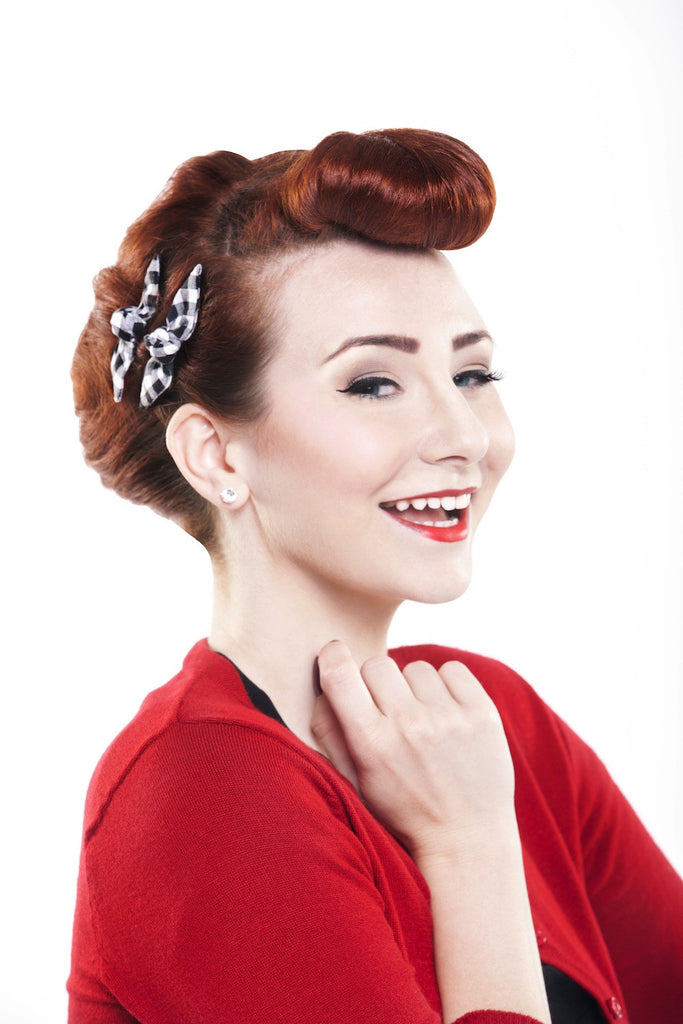 Model wearing Black Picnic Cute Knotted Bow by Lil' Lou Lou styled with bumper bangs and a vintage-inspired updo.
