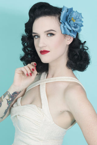 Model wearing the April Moon Rose Blue Hair Flower, a vintage-inspired blue rose hair clip for Pin Up, Rockabilly, and retro hairstyles.