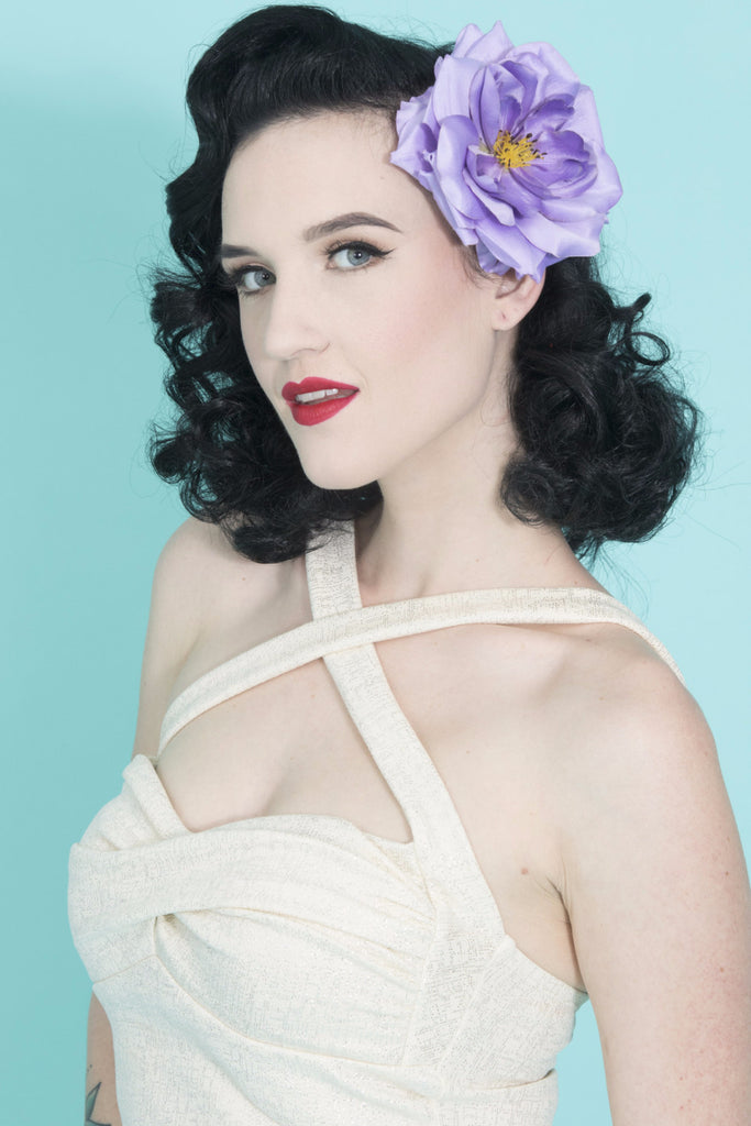 Model wearing the April Moon Rose Lilac Hair Flower, a vintage-inspired lilac rose hair clip for Pin Up, Rockabilly, and retro hairstyles.