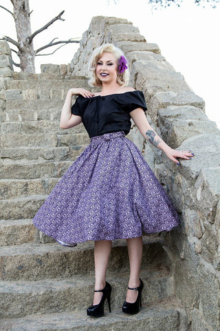 Model wearing a black Mary Blouse by Lil' Lou Lou with the purple Haunting Wallpaper Jivin' Skirt, showcasing vintage-inspired off-the-shoulder styling.