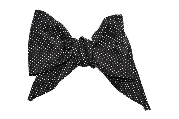 Black Mini Dot Minnie Bow Hair Clip by Lil' Lou Lou featuring a vintage inspired cotton bow for pin up and rockabilly hairstyles