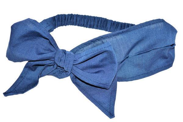 Navy cotton Minnie Headband inspired by vintage hair scarves, featuring a gathered scarf-style band, oversized side bow, and elasticized back.