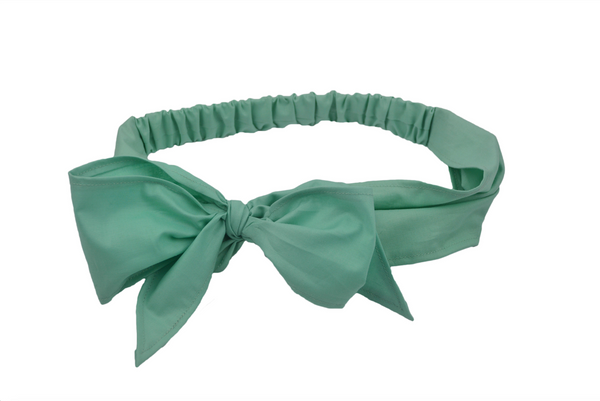 Seafoam green Minnie Headband with oversized bow shown in flat lay view, vintage-inspired cotton hair scarf headband by Lil' Lou Lou.