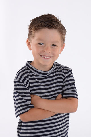Close-up of a child wearing the Lil' Lou Lou navy and gray striped kids tee inspired by vintage 1950s boys shirts.
