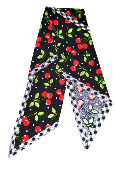 Flat lay of the Black Cherry Dots Rosie Bandana featuring cherry print fabric, white polka dots, and signature black and white gingham trim.