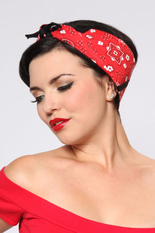 Model wearing the Rosie Bandana in red and black paisley print styled with vintage pinup hair and red lipstick.