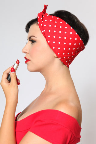 Model wearing the Red & White Dots Rosie Bandana with vintage pinup styling and red lipstick