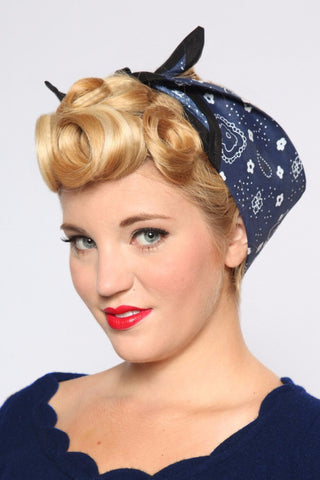 Blonde model with vintage pin curls wearing the True Blue Rosie Bandana in a classic rockabilly pinup hairstyle.
