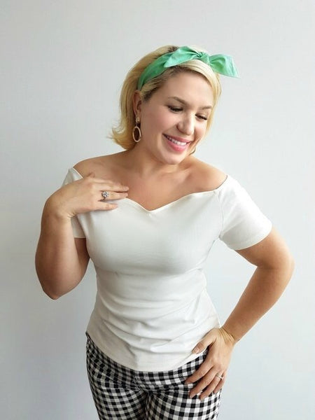 Woman wearing the Seafoam Green 4 in 1 Headband with removable bow styled with the Rockin' Cori Top