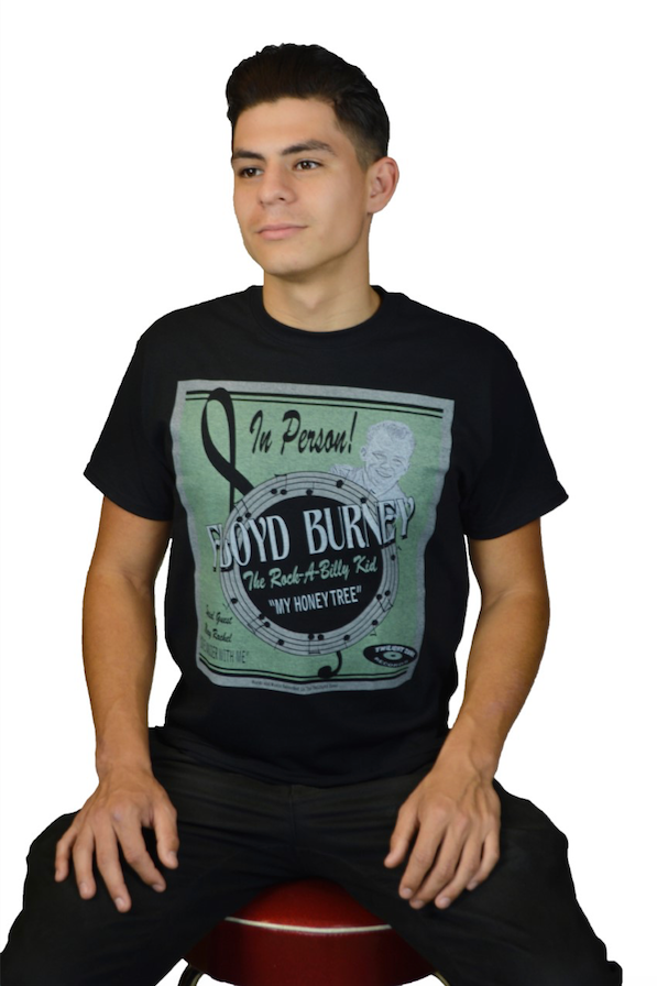 Male model wearing The Wandering Man tee featuring vintage concert poster inspired Floyd Burney artwork by Lily Gómez