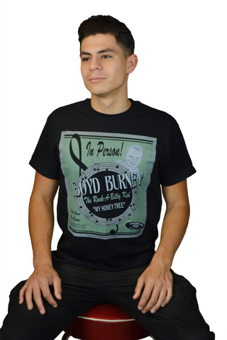 Male model wearing The Wandering Man tee featuring vintage concert poster inspired Floyd Burney artwork by Lily Gómez