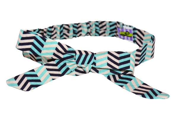 Chevron Aqua Tracy Headband featuring an aqua, white, and navy chevron print with an adjustable bow detail.