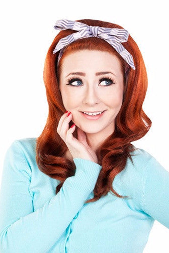 Model wearing the Tracy Headband in grey chevron fabric styled with a vintage inspired hairstyle.