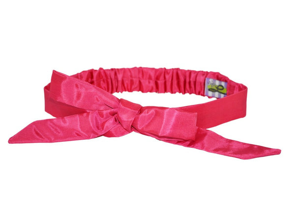 Hot pink taffeta Tracy Headband with adjustable bow inspired by vintage hairstyles and retro fashion.