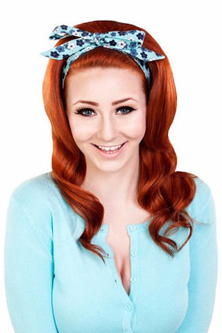 Model wearing the Wildflower Aqua Tracy Headband with a vintage hairstyle inspired by the original Hairspray film.