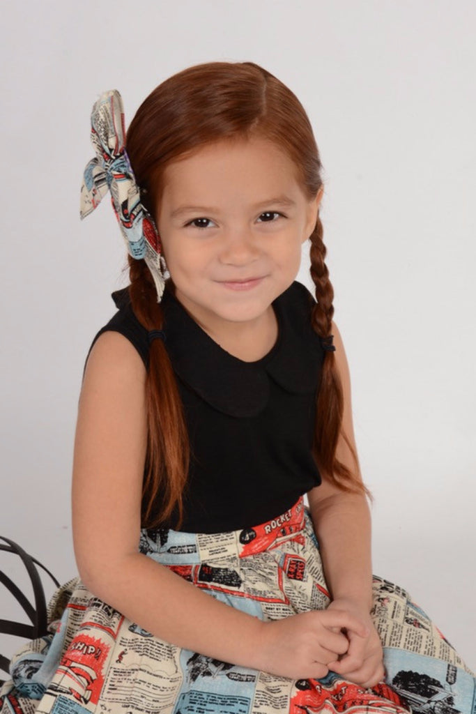 Girls black Peter Pan collar top with sleeveless design and vintage-inspired styling by Lil' Lou Lou.