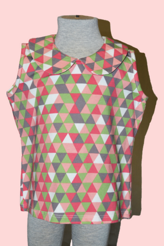 Girls Wendy Top in the Triangle Pink print featuring a Peter Pan collar and geometric Buen Viaje print by Lil' Lou Lou.