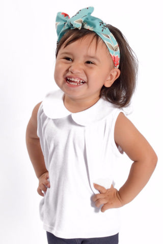 Toddler wearing the Wendy Top White, a girls Peter Pan collar top in soft jersey knit by Lil' Lou Lou.